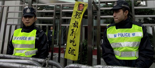 Pro-democracy protesters hold signs and posters of jailed Chinese Nobel Peace Prize laureate Liu Xiaobo (R) and his wife Liu Xia (C) during a protest outside the Chinese liaison office in Hong Kong Pro-democracy protesters hold signs and posters of jailed Chinese Nobel Peace Prize laureate Liu Xiaobo (R) and his wife Liu Xia (C) during a protest outside the Chinese liaison office in Hong Kong - Sputnik International