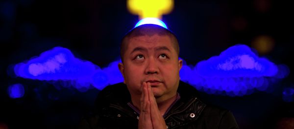 A Chinese man prays during a mass on the eve of Christmas at the South Cathedral official Catholic church in Beijing, China - Sputnik International