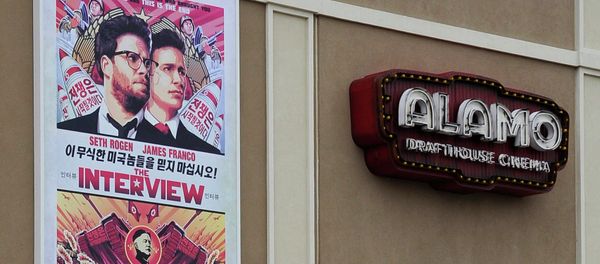 A large poster advertising the movie The Interview hangs on the back wall of the Alamo Drafthouse Cinema Tuesday in Houston A large poster advertising the movie The Interview hangs on the back wall of the Alamo Drafthouse Cinema Tuesday in Houston - Sputnik International