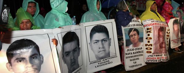 The relatives of 43 missing college students hold posters with images of their missing loved ones, as they protest their disappearance, at the Los Pinos presidential residence in Mexico City. The relatives of 43 missing college students hold posters with images of their missing loved ones, as they protest their disappearance, at the Los Pinos presidential residence in Mexico City. - Sputnik International