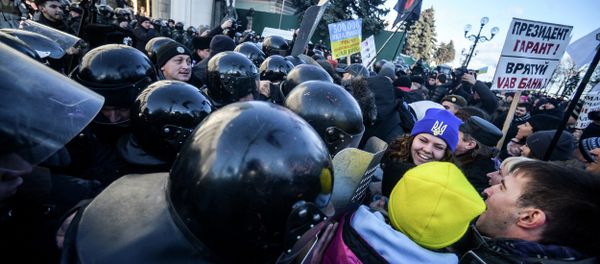 Russian LifeNews TV channel reported Thursday that two of its journalists have been attacked while covering the nationalists rally in Kiev. - Sputnik International
