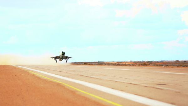 A MiG-21 fighter jet belonging to forces loyal to former general Khalifa Haftar takes off from a base on the outskirts of Al Sidra oil port, in Ras Lanuf - Sputnik International