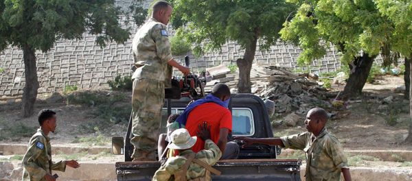 A blind-folded suspect is detained by Somalia security forces after attackers from the militant group al Shabaab invaded the African Union's Halane base on the edge of the Mogadishu international airport compound in Somalia's capital Mogadishu - Sputnik International