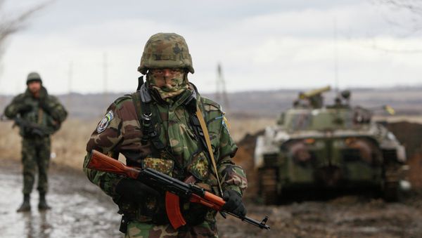 A Ukrainian serviceman guards at a checkpoint near the eastern Ukrainian town of Debaltseve in Donetsk region. A Ukrainian serviceman guards at a checkpoint near the eastern Ukrainian town of Debaltseve in Donetsk region. - Sputnik International