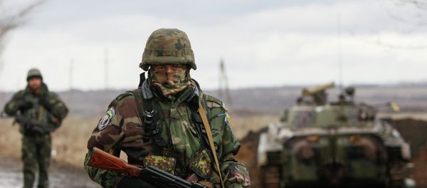 A Ukrainian serviceman guards at a checkpoint near the eastern Ukrainian town of Debaltseve in Donetsk region. A Ukrainian serviceman guards at a checkpoint near the eastern Ukrainian town of Debaltseve in Donetsk region. - Sputnik International