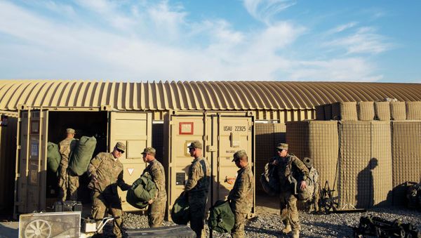 US soldiers from D Troop of the 3rd Cavalry Regiment load bags into a container in preparation for leaving Afghanistan. US soldiers from D Troop of the 3rd Cavalry Regiment load bags into a container in preparation for leaving Afghanistan. - Sputnik International