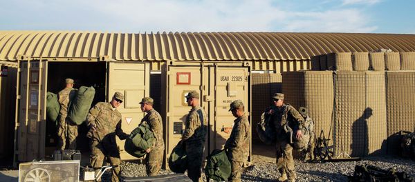 US soldiers from D Troop of the 3rd Cavalry Regiment load bags into a container in preparation for leaving Afghanistan. US soldiers from D Troop of the 3rd Cavalry Regiment load bags into a container in preparation for leaving Afghanistan. - Sputnik International