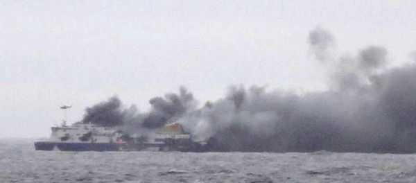 Smoke rises from the Italian-flagged Norman Atlantic after it caught fire in the Adriatic Sea Smoke rises from the Italian-flagged Norman Atlantic after it caught fire in the Adriatic Sea - Sputnik International