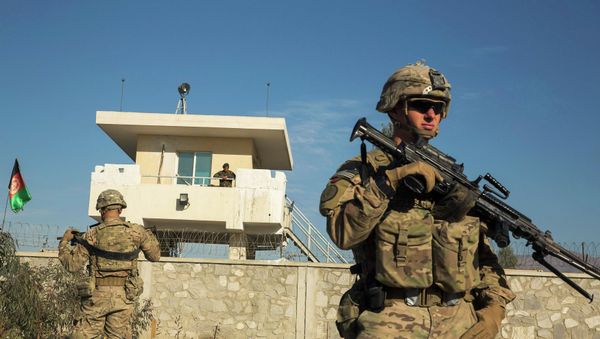 A U.S. soldier from Dragon Company of the 3rd Cavalry Regiment stands in front of an Afghan National Army guard post during a mission near forward operating base Gamberi in the Laghman province of Afghanistan December 28, 2014 - Sputnik International