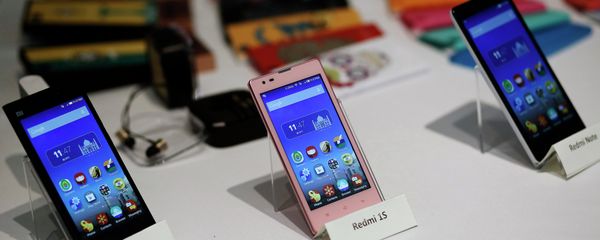 Three models of China's Xiaomi Mi phones are pictured during their launch in New Delhi in this July 15, 2014 file photo - Sputnik International