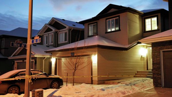 Police cordon tape surrounds a house (R, with lights on) where seven people were found dead - Sputnik International
