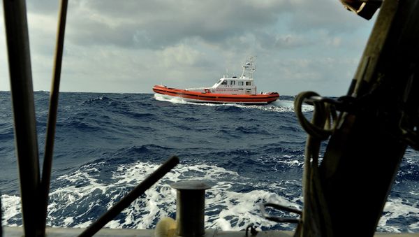 The Italian Coast Guard commandeered a Moldovan-flagged refugee-laden freighter which was on course to crash into the Italian coast The Italian Coast Guard commandeered a Moldovan-flagged refugee-laden freighter which was on course to crash into the Italian coast - Sputnik International