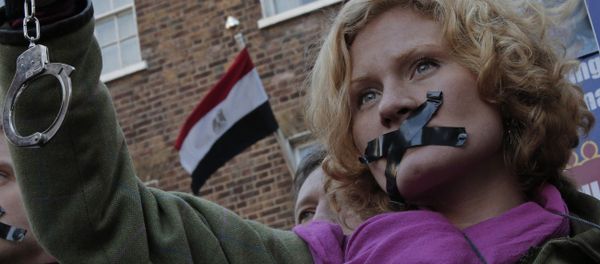 A journalist, with black tape over the mouth to illustrate the silencing of free speech and journalists A journalist, with black tape over the mouth to illustrate the silencing of free speech and journalists - Sputnik International