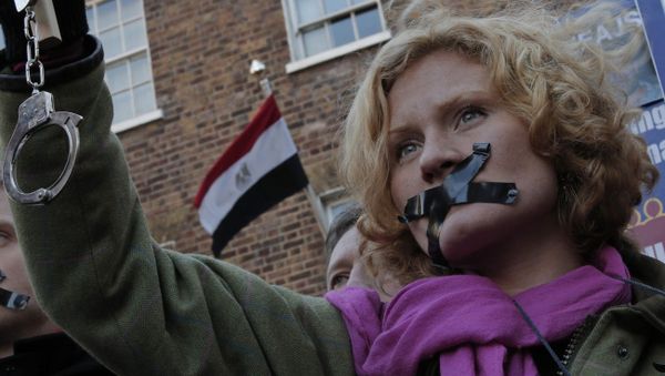 A journalist, with black tape over the mouth to illustrate the silencing of free speech and journalists A journalist, with black tape over the mouth to illustrate the silencing of free speech and journalists - Sputnik International