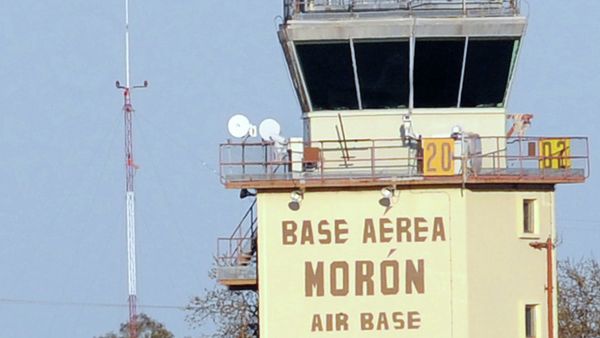 Firefighters stand in front of an air traffic control tower at the Moron de la Frontera air base near Sevilla - Sputnik International