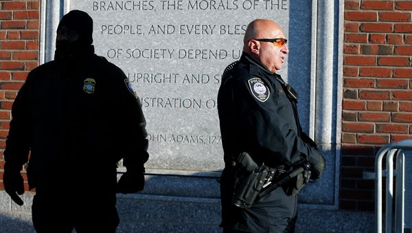 Police officers stand outside the federal courthouse in Boston for the first day of jury selection in the trial of Boston Marathon bombing suspect Dzhokhar Tsarnaev - Sputnik International