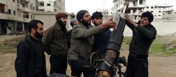 Free Syrian Army fighters use an iPad as they prepare to launch a weapon toward the forces of Syria's President Bashar al-Assad in Ain Tarma, in Eastern Ghouta, a suburb of Damascus January 3, 2015. Free Syrian Army fighters use an iPad as they prepare to launch a weapon toward the forces of Syria's President Bashar al-Assad in Ain Tarma, in Eastern Ghouta, a suburb of Damascus January 3, 2015. - Sputnik International