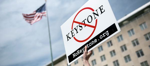 An activist holds up a sign outside the State Department during a protest of the Keystone XL pipeline on March 7, 2014 in Washington - Sputnik International