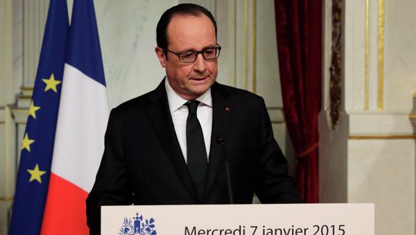 French President Francois Hollande delivers a speech at the Elysee Palace after a shooting at the Paris headquarters of satirical weekly Charlie Hebdo killing at least 12 people and injuring many, January 7, 2015 - Sputnik International