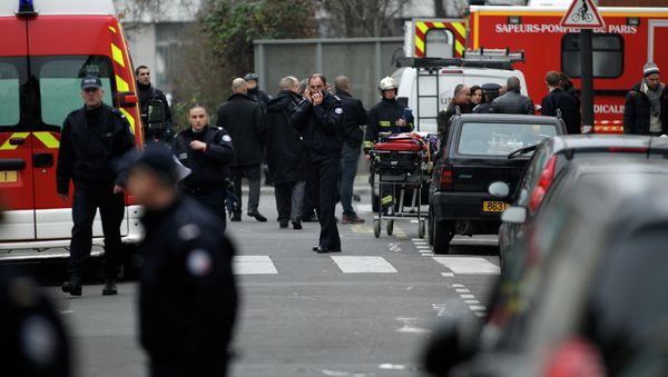 Police officers and firemen gather outside the French satirical newspaper Charlie Hebdo's office, in Paris, Wednesday, Jan. 7, 2015 Police officers and firemen gather outside the French satirical newspaper Charlie Hebdo's office, in Paris, Wednesday, Jan. 7, 2015 - Sputnik International