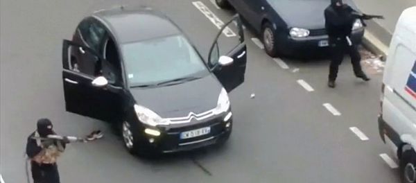 Gunmen flee the offices of French satirical newspaper Charlie Hebdo in Paris, in this still image taken from amateur video shot on January 7, 2015, and obtained by Reuters Gunmen flee the offices of French satirical newspaper Charlie Hebdo in Paris, in this still image taken from amateur video shot on January 7, 2015, and obtained by Reuters - Sputnik International