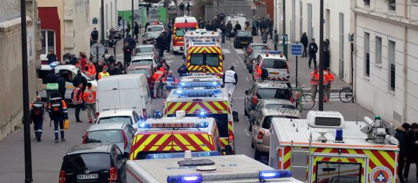 Ambulances gather in the street outside the French satirical newspaper Charlie Hebdo's office, in Paris, Wednesday, Jan. 7, 2015 Ambulances gather in the street outside the French satirical newspaper Charlie Hebdo's office, in Paris, Wednesday, Jan. 7, 2015 - Sputnik International