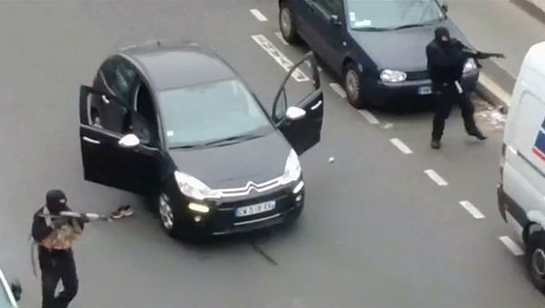 Gunmen flee the offices of French satirical newspaper Charlie Hebdo in Paris, in this still image taken from amateur video shot on January 7, 2015, and obtained by Reuters Gunmen flee the offices of French satirical newspaper Charlie Hebdo in Paris, in this still image taken from amateur video shot on January 7, 2015, and obtained by Reuters - Sputnik International