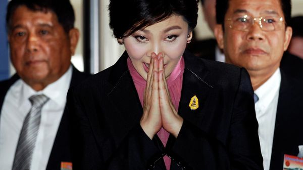 Ousted former Prime Minister Yingluck Shinawatra greets in a traditional way as she arrives at Parliament before the National Legislative Assembly meeting in Bangkok January 9, 2015. Ousted former Prime Minister Yingluck Shinawatra greets in a traditional way as she arrives at Parliament before the National Legislative Assembly meeting in Bangkok January 9, 2015. - Sputnik International