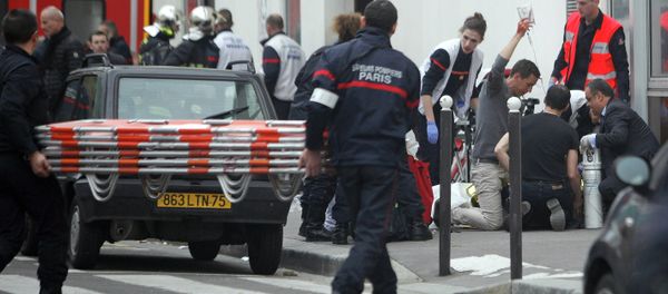 An injured person is treated by nursing staff outside the French satirical newspaper Charlie Hebdo's office, in Paris, Wednesday, Jan. 7, 2015 An injured person is treated by nursing staff outside the French satirical newspaper Charlie Hebdo's office, in Paris, Wednesday, Jan. 7, 2015 - Sputnik International
