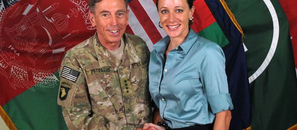 The former Commander of International Security Assistance Force and U.S. Forces-Afghanistan Gen. Davis Petraeus, left, shaking hands with Paula Broadwell, co-author of All In: The Education of General David Petraeus. - Sputnik International