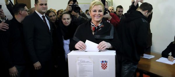 Presidential candidate Kolinda Grabar Kitarovic casts her vote at a polling booth during the presidential run-off election in Zagreb January 11, 2015. Presidential candidate Kolinda Grabar Kitarovic casts her vote at a polling booth during the presidential run-off election in Zagreb January 11, 2015. - Sputnik International