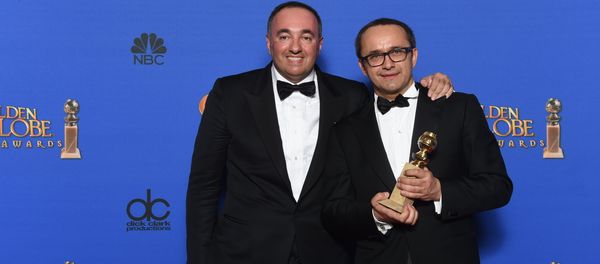 Alexander Rodnyansky and Andrey Zvyagintsev pose with the award for Best Foreign Language Film for Leviathan, in the press room at the 72nd annual Golden Globe Awards - Sputnik International