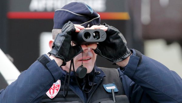 A policeman uses binoculars as he secures the hundreds of thousands of French citizens solidarity march A policeman uses binoculars as he secures the hundreds of thousands of French citizens solidarity march - Sputnik International