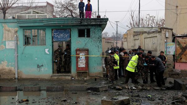 Afghan security personnel investigate the site of a blast in Kabul January 13, 2015. Afghan security personnel investigate the site of a blast in Kabul January 13, 2015. - Sputnik International