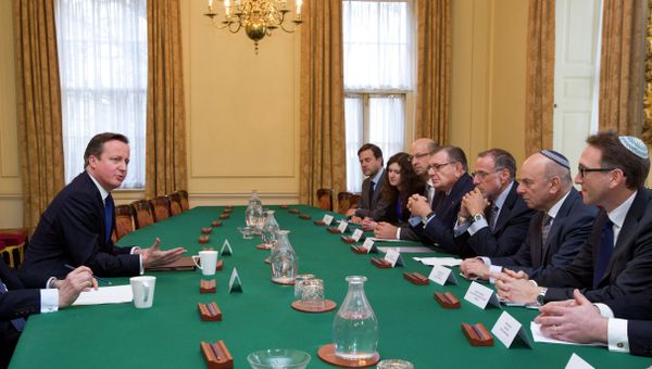 British Prime Minister David Cameron (L) talks with members of the Jewish Leadership Council including Gerald Ronson (4L) and Jonathan Goldstein (R) during their annual meeting at 10 Downing Street in London on Janurary 13, 2015 British Prime Minister David Cameron (L) talks with members of the Jewish Leadership Council including Gerald Ronson (4L) and Jonathan Goldstein (R) during their annual meeting at 10 Downing Street in London on Janurary 13, 2015 - Sputnik International