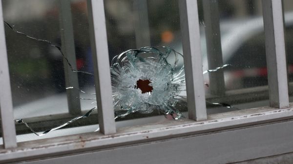 A bullet impact is seen in a window - Sputnik International