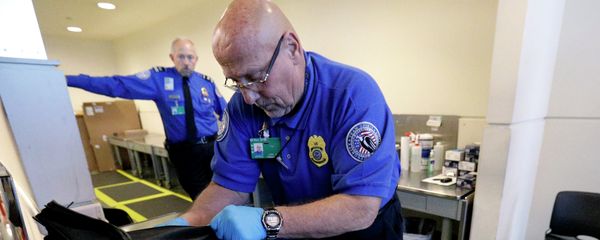 A TSA agent checks a bag at a security checkpoint area at Midway International Airport, Friday, Nov. 21, 2014, in Chicago A TSA agent checks a bag at a security checkpoint area at Midway International Airport, Friday, Nov. 21, 2014, in Chicago - Sputnik International