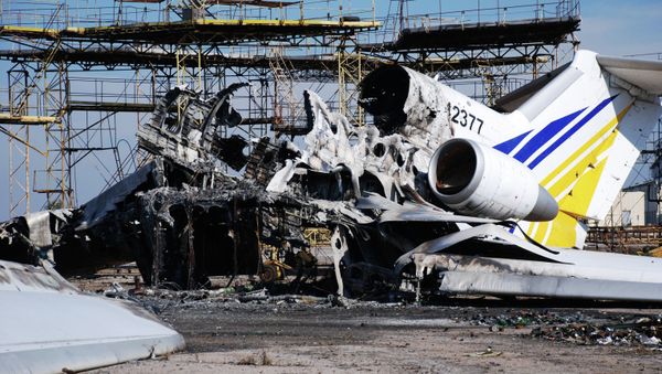 A burned plane at Donetsk airport A burned plane at Donetsk airport - Sputnik International