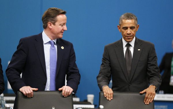 U.S. President Barack Obama and British Prime Minister David Cameron, left, take their seats at the first plenary session of the G20 summit  - Sputnik International