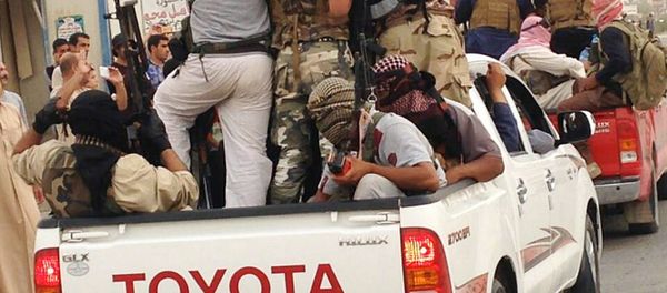 In this Tuesday, July 29, 2014, file photo, Islamic militants parade in Beiji, some 250 kilometers (155 miles) north of the capital, Baghdad, Iraq - Sputnik International