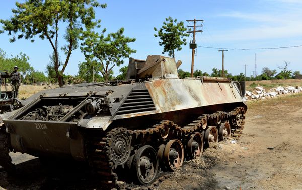 This picture taken on November 12, 2014 in front of the military base of Amchide, northern Cameroon, 1 km from Nigeria, shows a Boko Haram's tank destroyed by Cameroonian soldiers during an attack againts the military base by the Islamic fighters on October 15, 2014. This picture taken on November 12, 2014 in front of the military base of Amchide, northern Cameroon, 1 km from Nigeria, shows a Boko Haram's tank destroyed by Cameroonian soldiers during an attack againts the military base by the Islamic fighters on October 15, 2014. - Sputnik International