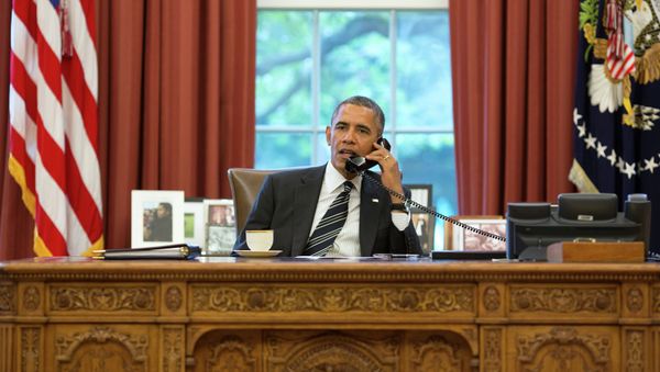 President Barack Obama talks with President Hassan Rouhani of Iran during a phone call in the Oval Office, September 27, 2013 - Sputnik International