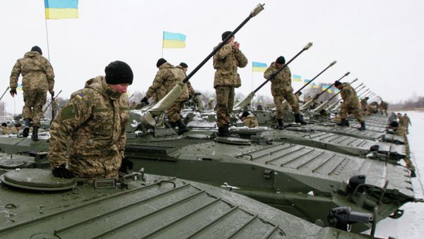 Ukrainian servicemen get inside armoured personnel carriers (APC) during a ceremony to hand over weapons, military equipment and aircraft to the army at a firing range outside Zhytomyr January 5, 2015 Ukrainian servicemen get inside armoured personnel carriers (APC) during a ceremony to hand over weapons, military equipment and aircraft to the army at a firing range outside Zhytomyr January 5, 2015 - Sputnik International