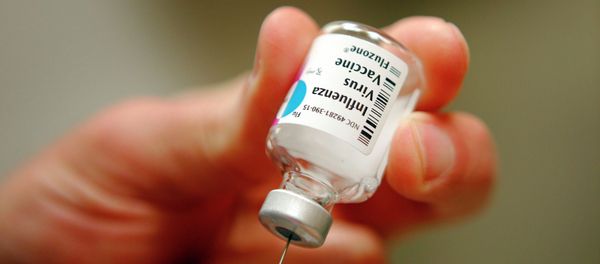 A nurse prepares an injection of the influenza vaccine at Massachusetts General Hospital A nurse prepares an injection of the influenza vaccine at Massachusetts General Hospital - Sputnik International
