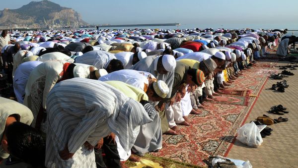 Muslims pray during Eid al-Fitr prayer, which marks the end of the holy month of Ramadan, in Palermo, Italy Muslims pray during Eid al-Fitr prayer, which marks the end of the holy month of Ramadan, in Palermo, Italy - Sputnik International