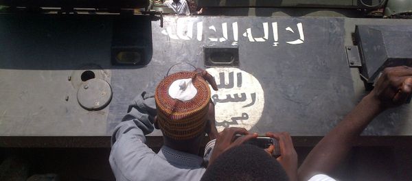 Maiduguri residents gather on September 16, 2014 around an armored personnel carrier (APC) recovered by the army from Boko Haram insurgents in Konduga Maiduguri residents gather on September 16, 2014 around an armored personnel carrier (APC) recovered by the army from Boko Haram insurgents in Konduga - Sputnik International