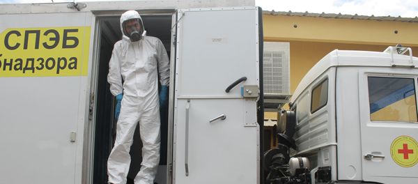 Russian doctor Valentine Safronov stands inside a mobile medical lab donated by the Russian government to assist with the Ebola outbreak in Conakry, Guinea. Russian doctor Valentine Safronov stands inside a mobile medical lab donated by the Russian government to assist with the Ebola outbreak in Conakry, Guinea. - Sputnik International