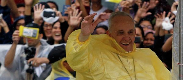 Pope Francis smiles as he waves to residents during a motorcade in Tacloban city, after holding a mass near the airport, January 17, 2015 Pope Francis smiles as he waves to residents during a motorcade in Tacloban city, after holding a mass near the airport, January 17, 2015 - Sputnik International
