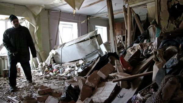 Local resident Nikolai, 82, inspects his apartment, which according to locals, was recently destroyed by shelling, in Donetsk - Sputnik International