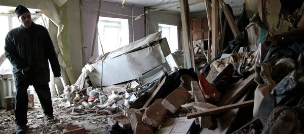 Local resident Nikolai, 82, inspects his apartment, which according to locals, was recently destroyed by shelling, in Donetsk Local resident Nikolai, 82, inspects his apartment, which according to locals, was recently destroyed by shelling, in Donetsk - Sputnik International